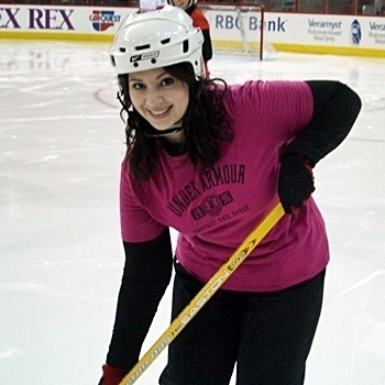 Monica playing hockey